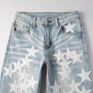 Slim fit light blue jeans with white star patchwork and washed whiskers effect for women
