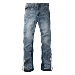 Men's retro color block flared jeans in mid blue wash with patchwork denim side panels