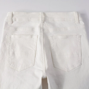 Detail of white stretch denim jeans showing rear waist, belt loops and twin back pockets