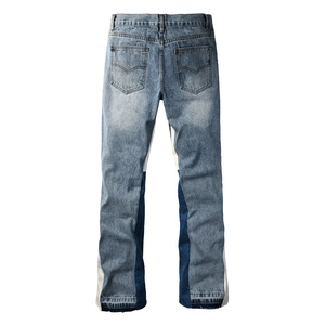 Detailed back view of men's flare jeans featuring unique contrast patchwork and denim fabric