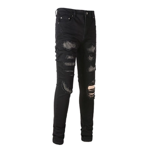 Men's slim-fit black street jeans with distressed ripped details and silver rhinestone mesh