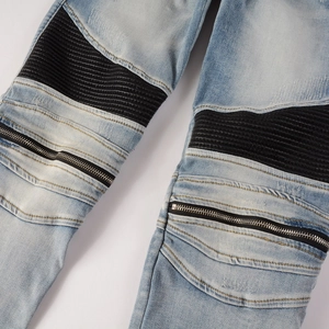 Men's light blue biker jeans featuring black ribbed paneling and metal zipper details