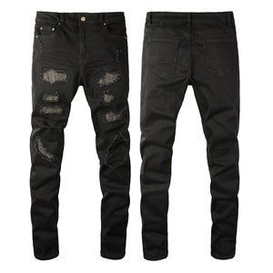 Men's slim fit black distressed jeans with rhinestone embellishments and ripped denim details
