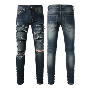 Slim fit men's distressed denim jeans in dark blue wash with ripped patch details