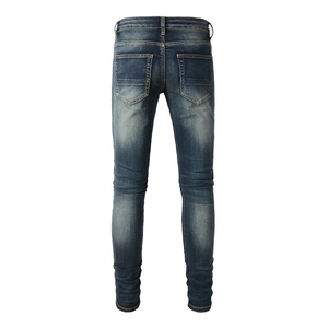 Slim fit men's distressed jeans in vintage wash blue featuring classic back pocket design