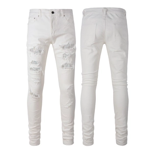 Slim fit white distressed jeans for men with rhinestone patches and ripped details
