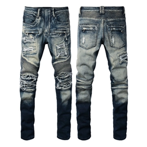 Men's distressed biker jeans in dark blue wash featuring pleated knee panels and patches
