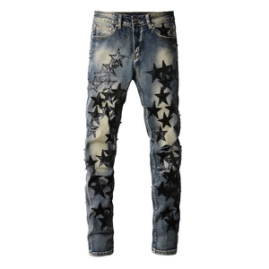 Slim fit men's blue washed jeans with black star leather patches and ripped knee detail