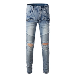 Jean moto homme bleu clair avec détails déchirés et empiècements nervurés