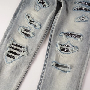 Slim fit light blue distressed jeans with paisley patchwork and ripped detailing for men
