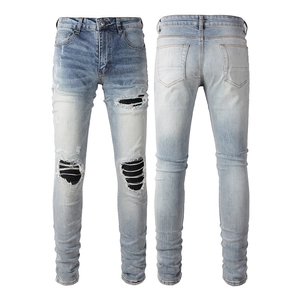 Slim fit light blue distressed men's jeans with black ribbed PU patches and ripped details