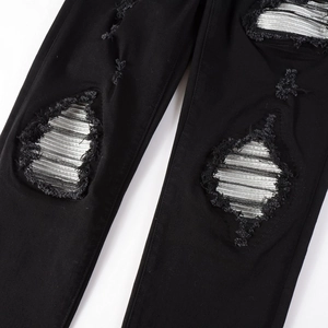 Slim fit black distressed jeans for men with metallic silver patchwork and frayed edges