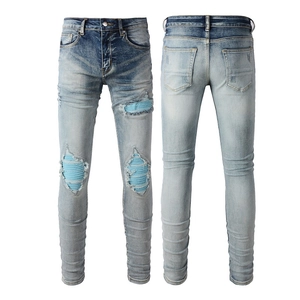 Men's slim fit light blue ripped jeans with patchwork inner lining and wash effects