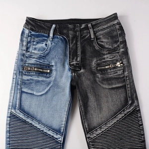 Detail of biker-style pleated panels and two-tone denim stitching on slim fit motor jeans