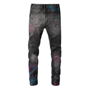 Back view of men's slim fit jeans with colorful paint splatter and gradient dye effects