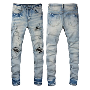 Light blue slim fit ripped jeans for men featuring vintage wash and striped lining details
