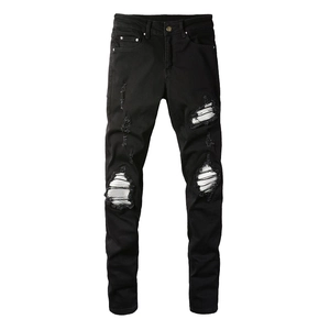 Men's slim fit black distressed jeans with white striped patchwork and ripped details