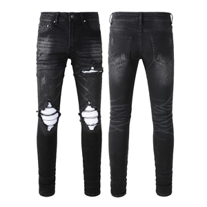Men's retro distressed black slim fit jeans with washed denim holes and knee detail