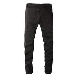 Detail view of mens slim fit black jeans featuring back pockets and reinforced stitching