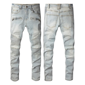 Men's light blue distressed moto jeans with pleated knee panels and decorative zippers