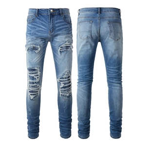Men's high street distressed jeans with blue denim wash and stylish PU patch details