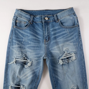 Light blue washed distressed jeans with PU patches and large ripped knee details