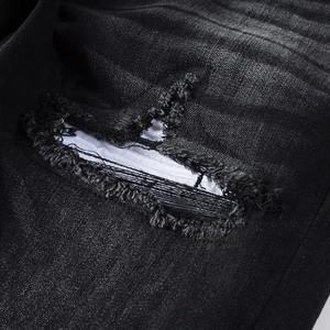 Men's vintage washed black distressed jeans with ripped detailing and fabric lining