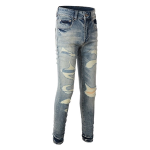 Jean slim bleu clair pour homme avec patchwork épais et détails de déchirures usées
