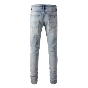 Back view of light blue slim fit men's jeans with distressed wash and pocket detail