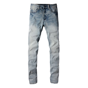 Men's slim fit stretch jeans in light blue with distressed finish and whiskering
