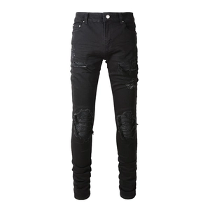 Men's slim fit black biker jeans with distressed ripped knees and pleated moto details