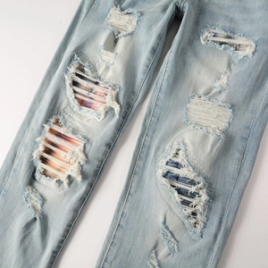 Slim fit light blue distressed jeans for men with gradient wash and ripped denim patches