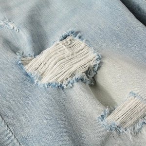 Slim fit distressed blue denim jeans for men with ripped white fiber thread detail