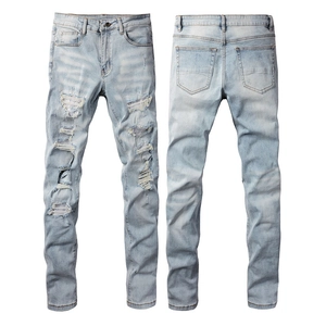 Front and back view of light blue distressed jeans with patchwork and cat-whiskers detail