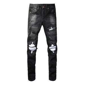 Men's black distressed slim fit jeans with vintage washed denim and knee rip details