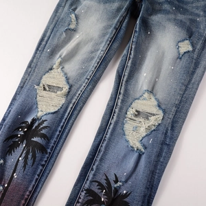Men's slim stretch denim jeans with palm tree print, distress holes and paint splatter