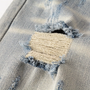Jean slim pour homme au style rétro délavé bleu clair avec détails de patchs tissés