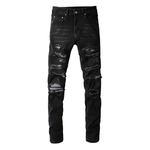 Slim fit black distressed jeans with heavy ripped detailing and street style wash finish