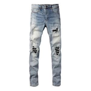 Men's slim fit distressed blue jeans with ripped knees and black striped patches