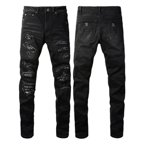 Men's slim-fit black distressed denim jeans with street style ripped patchwork detail