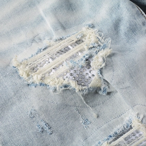 Men's high street distressed light blue jeans featuring rhinestone patched holes design