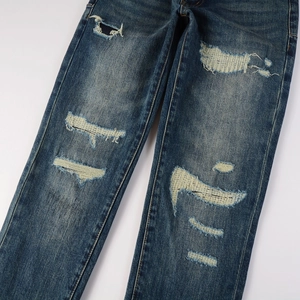 Men's distressed slim fit jeans in blue denim with wash effect and patch details