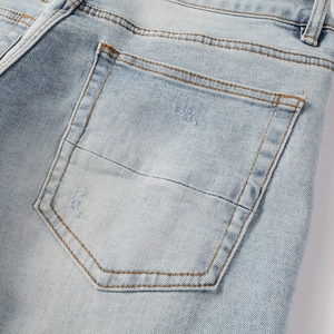 Light blue distressed denim jeans with vintage washed back pocket and rip details