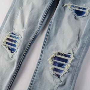 Jean homme style high street avec déchirures et patchs colorés en denim extensible bleu