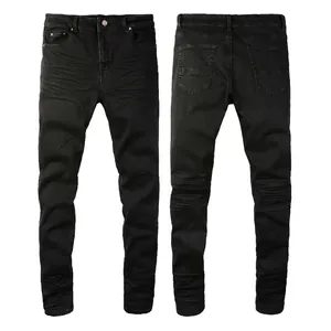 Slim fit black biker jeans for men with pleated knee details and front faded whiskering