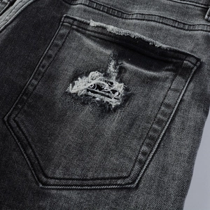 Slim fit dark grey distressed denim jeans with vintage washed back pocket detail