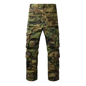 Close-up of army green camouflage cargo pants featuring multiple large back pockets