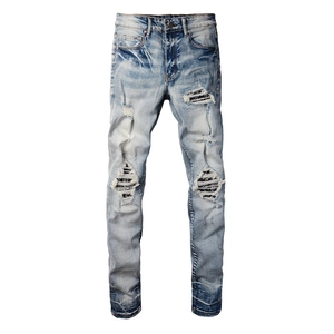 Slim fit light blue men's distressed jeans with ripped patchwork and striped fabric