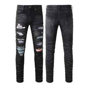 Men's slim fit black distressed jeans with colorful patchwork and ripped street style details