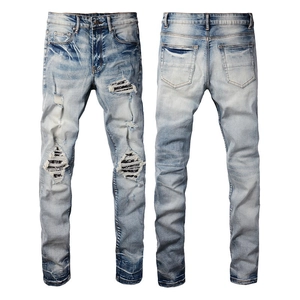 Slim fit light blue ripped denim jeans with striped patches for men front and back view
